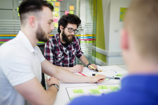 meeting in progress with post-it notes